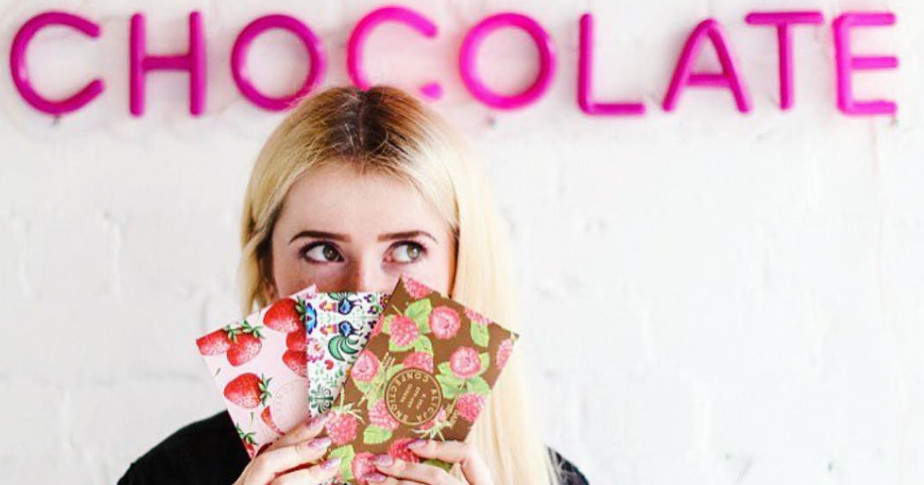 Alicja Confections owner, Alicja Buchowicz poses with chocolate bars in her retail store. 